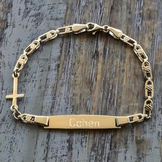 This is a Personalized Engraved Baby Id Cross Bracelet which is 16.5 cm (6.5'') long and the weight is 2.9 gr. I hallmark all the items. Here is some details of the item: Gold-Glossy finish-Hand made-Evil Eye-Hallmarked. The Bracelet is shipped in a really nice gift box.   Here is some general information about gold carat: There are several carats available for gold. The carat is the gold content of the metal. The carat measures the proportion of pure gold mixed with other metal alloy to make up Personalized Cross Rosary Bracelet For Baptism, Gold Cross Bracelet For Baptism, Customizable Gold Jewelry For First Communion, Personalized Gold Rosary Bracelet For Birthday, Personalized Gold Rosary Bracelet For Baptism, Personalized Gold Name Bracelet For Baptism, Personalized Gold Rosary Bracelet For First Communion, Personalised Baby Bracelet, Boys Bracelets