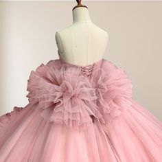 Step into a fairytale with this Pink Strapless Sleeveless Ball Gown Corset Quinceanera Dress. This dress's soft pink hue exudes romance and charm, perfect for your grand celebration. The strapless neckline beautifully highlights your shoulders and collarbones, while the sleeveless design adds a timeless and elegant touch. The voluminous ball gown silhouette is enhanced with cascading ruffles that bring drama and movement to your look. The corset back ensures a flawless fit, accentuating your fig Corset Quinceanera Dresses, Ball Gown Corset, Sleeveless Ball Gown, Quinceanera Dresses Pink, White Homecoming Dresses, Blue Homecoming Dresses, Gown Style, Corset Back, Strapless Neckline