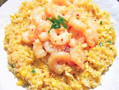 rice with shrimp and garnishes on it