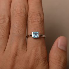 This is a gorgeous handmade creation. Its beauty is its simplicity & Elegance. The 6*6 mm Square cut swiss blue topaz(about 1.24ct) is crafted in solid sterling silver or 14k white/rose/yellow gold All item is sent in a beautiful gift box If you have any idea of design your ring,pls contact me directly. You can realize more lovely stuff clicking the link https://www.etsy.com/shop/knightjewelry?refshopsection_shophome_leftnav Please leave the correct address and you phone number for deliverin Swiss Blue Topaz Ring, Ring White Gold, Etsy Wedding Rings, Jewelry Wedding Rings, Rose Yellow, Swiss Blue Topaz, Square Cut, Jewelry Wedding, Blue Topaz Ring