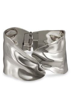 Sculptural waves catch the light on an abstract hinged cuff bracelet crafted from lightweight steel with a glossy rhodium plate. Rhodium plate Imported Statement Bracelets Cuffs, Statement Bracelets, Statement Cuff Bracelet, Summer Wardrobe Essentials, Wide Cuff Bracelets, Wedding Guest Shoes, Wide Cuff, Baby Boy Shoes, Statement Bracelet