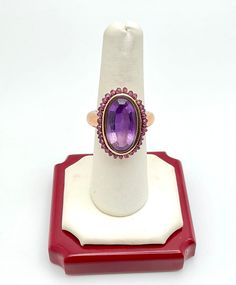 Gorgeous Vintage 14K Yellow Gold Amethyst Cocktail Ring Size 7 A perfect gift for your loved one for any special occasion or holiday! Total Ring Weight: 9.59g Ring Length: 23.47mm Ring Width: 23.63mm Gemstone: Amethyst Item will be placed in a gift box. Purple Ruby Ring For Formal Occasions, Fine Jewelry Purple Amethyst Cabochon Ring, Purple Amethyst Cabochon Ring Fine Jewelry, Formal Purple Ruby Ring With Center Stone, Formal Purple Cabochon Amethyst Ring, Elegant Purple Ruby Ring, Formal Purple Ruby Ring, Fine Jewelry Amethyst Ring Stamped 14k, Elegant Purple Ruby Ring In 14k Gold