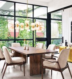 a dining collection constructed from metal and wood paired with a modern glam gold chandelier Plank Table, Esstisch Modern, Dining Arm Chair, Burke Decor, Modern Dining Room, Dining Room Design, Upholstered Dining Chairs, Dining Room Sets, Modern Dining