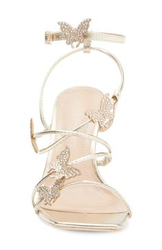 Svelte straps wend their across a square-toe sandal topped with crystal-embellished butterflies to complete a charming style. 3" heel Synthetic upper and lining/rubber sole Imported Butterfly Heels, Butterfly Sandals, Classic Slippers, Square Toe Sandals, Flip Flop Slippers, Clutch Pouch, Ugg Classic, Halloween Fashion, Sweaters And Leggings