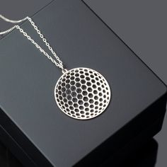 "Round Honeycomb Necklace in Sterling Silver, Geometric Pendant with Honeycomb Shapes is made by hand in our workshop with care. All our jewelry is the most elegant choice for the Bridesmaids, friends, your loved ones and for yourself. Round Honeycomb Necklace in Sterling Silver, Geometric Pendant with Honeycomb Shapes * Material: High Quality Solid 925 Sterling Silver. * Finish: Sterling Silver ∙ 18K Gold ∙ Rose Gold. * All our jewelry is custom made by hand with care in our workshop.  HOW TO O Silver Hexagon Necklace For Jewelry Making, Honeycomb Necklace, Honeycomb Shape, Jewelry Dainty, Geometric Pendant, Inspired Jewelry, Hexagon Shape, Solid 925 Sterling Silver, Sterling Silber