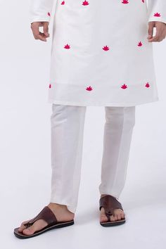 Ivory kurta with thread embroidered lotus patterns. Comes with pyjama. - Aza Fashions Cream Cotton Traditional Wear With Embroidered Border, Cream Cotton Kurta With Embroidered Border, White Kurta With Motifs For Traditional Ceremonies, Ceremonial White Sets With Chikankari Embroidery, Off White Embroidered Cotton Traditional Wear, White Cotton Set With Intricate Embroidery, Embroidered Off White Cotton Traditional Wear, Fitted Cotton Sherwani With Traditional Patterns, Off White Cotton Traditional Wear For Wedding