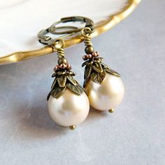 Victorian Pearl Earrings - Ivory Cream Bridal Earrings - Vintage White Pearl Drops - Rustic Boho Wedding .. .. .. These ornate Victorian Pearl Earrings are adorned in layers of graceful vintage style antique gold bead caps, and small round beads. The Czech glass pearls are designed with a rustic boho flair. Personalized your Pearl Earrings with your choice of pearl colors. Select Victorian Cream or White Pearls from the drop down menu. Pearl Earrings always make a thoughtful gift for her. . . . Pearl Drop Earrings Bridal, Rustic Boho Wedding, Jewelry Promotion, Pearl Earrings Wedding, Pearl Jewelry Wedding, Bridal Earrings Pearl, Rustic Boho, Wedding Bridal Jewellery, Ivory Pearl