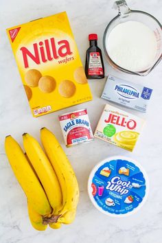 bananas, milk, yogurt, and other ingredients on a counter