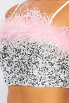 Dazzling sequins and pink feathers pave the way on this spectacular crop that's sure to be a hit from celebrations to nights on the town. • Pink Feather Trim• Adj. Straps• Pull On• Crop• Silver Sequins Sequin Crop Top, Feather Trim, Pink Feathers, Silver Sequin, Personalized Accessories, Feathers, Sequin, Crop Top, Trim