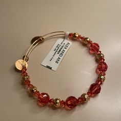 Never Worn! Brand New With Tags! In Perfect Condition. Beautiful Red Iridescent And Gold Beads. Expandable And Fits Any Size Wrist. Alex And Ani Beaded Bracelets, Elegant Crystal Bracelet With Colorful Beads, Elegant Beaded Bracelets For Holidays, Elegant Beaded Bracelet For Holidays, Elegant Beaded Holiday Bracelet, Red Crystal Bracelet For Party, Faceted Crystal Bracelet For Parties, Elegant Adjustable Red Crystal Bracelet, Elegant Red Adjustable Crystal Bracelet