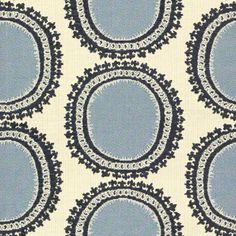 a blue and white fabric with circles on it