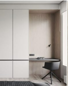 a bedroom with white closets and black chair next to the bed in front of it