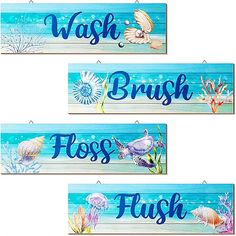 three wooden signs that say wash brush, floss flush and seashell on them