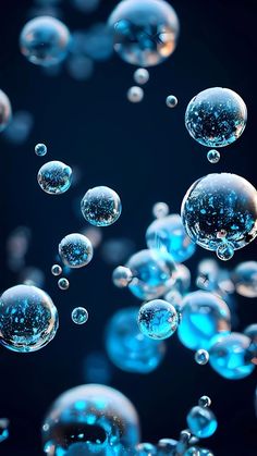 blue bubbles floating in the air on a black background