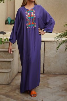 cotton guandoura dress in dark purple ethnic color with multicolored embroidery Purple Embroidered Bohemian Dress, Embroidered Long Sleeve Purple Kaftan, Traditional Purple Festival Dress, Traditional Purple Dresses For Festivals, Purple Long Sleeve Maxi Dress For Festival, Bohemian Purple Cotton Maxi Dress, Purple Cotton Embroidered Dress, Purple Embroidered Cotton Dress, Traditional Purple Maxi Dress