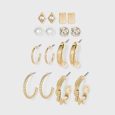 Polish off your outfits with the glam appeal of this 8-Piece Multi Gold Hoops and Cubic Zirconia Stud Earring Set from A New Day™. This eight-piece earring set includes stud earrings ranging from simple to pearl to twisted and more to make them suitable for a range of occasions. Whether worn alone or paired with other accessories, this stud and hoop earring set will add a perfect finishing touch to your looks. Target Earrings, Dr Accessories, Hoop Earring Set, Xmas List, Earring Sets, Nickel Free Earrings, Bar Studs, Ear Cuff Earings, Easter Candy