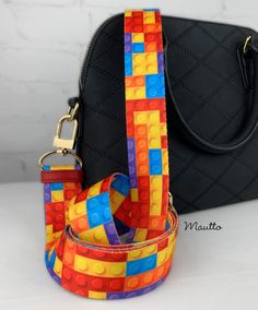 "Everything is awesome when using this hipster strap! This colorful pattern is for the fans of building bricks and blocks. Strap is comprised of approximately 400 pieces, and suitable for brick builders with little to no experience (kidding!). This adjustable strap uses a methodically connected array of colorful bricks. Express your love for the classic colorful bricks, and... add some color, fun and flair to your bag or attire! Strap is reversible with colorful brick pattern on both sides. Fits Brick Pattern, Custom Strap, Brick Colors, Brick Patterns, Everything Is Awesome, Purse Strap, Purple Bags, Purse Bag, Black Bag