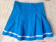 Vintage Pleated Mini Skirt | Tennis Skirt | 90s Mini Skirt | 80s Blue Mini Skirt | Sports Skirt | Activewear Skirt | Preppy Grunge Skirt |s | cheerleader skirt  1980s cheerleader sporty, bright blue mini skirt with a reflective stripe at the bottom.  Great condition, no noticeable flaws. Size: about an S/M Small / Medium US 2 - 6 or UK 6- 10 depending whether to wear it higher on the waist or lower at the hips. Measurements laid flat at the waist: 13.5 in. So waist would be 27 in. Max. PLEASE  N Cheap Y2k Style Blue Skirt, Retro Mini Skirt Skort For School, Retro Mini Skort For School, Retro School Mini Skort, Retro Pleated Skort For School, Blue Stretch Skort For School, Retro Blue Fitted Skort, Fitted Blue Skirt With 90s Style, Blue Fitted Skirt 90s Style