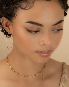 These delicate faux hoops are perfect if you don't have a piercing but want to rock the look. Faux hoops are sold individually and are easy and comfortable to wear. You will absolutely love the beauty and simplicity of these hoops! *Hand forged from high quality jeweler's wire *Customize your wire thickness (gauge) | choice of 22g and 20g *Customize your diameter size (mm) | choice of 5 to 10mm *Handmade using your choice of Sterling Silver, 14k Gold-Filled or 14K Rose Gold-Filled -------------- Fake Lip Ring, Faux Nose Ring, Fake Nose Ring, Gold Nose Ring, Fake Nose Rings, Fake Nose, Gold Nose Rings, Nose Rings Hoop, Nose Rings