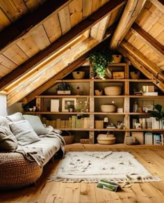 a living room filled with lots of furniture and bookshelves on top of wooden shelves