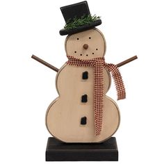 a wooden snowman with a black hat and red checkered scarf on it's head