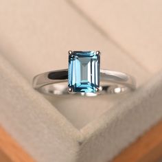 This ring features a 6*8 mm emerald cut London blue topaz,and sterling silver finished with rhodium. Customization is available. It is made by hand, and it will take about 7 days to finish the ring after your payment is completed. Main stone: London blue topaz Main stone weight: Approx 2.01 ct Metal type: sterling silver finished with rhodium Accent stone: none Customization is available, I also can make it with 14k solid gold (white or yellow or rose) and diamond accent stone, just feel free to Blue Gemstone Ring, Ring Emerald Cut, Birthday Gift Ring, Blue Gemstone Rings, London Blue Topaz Ring, Ring Blue, Blue Gemstones, Blue Topaz Ring, Ring Engagement