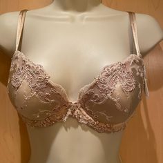 With Generous Gold And Copper Embroidered Lace And Softly Padded Silk Satin Cups, This Push-Up Bra Is Breathtaking. Perfect With Low-Cut Tops Or Dresses, The Molded Cups Provide Lift And Enhancement. A Swarovski Pendant Lies Between The Cups, And Small Swarovski Crystals Make The Embroidered Lace Dazzling. With Embroidered Stretch Tulle On The Sides And Back, The Plunge Bra Has Adjustable Silk Satin Straps. Make Sure To Pair This Bra With The Bijou De Soie Italian Bikini Or Boyshort. Elegant Underwire Bra For Wedding Night, Elegant Lace Bra For Wedding Night, Fitted Low-cut Bra For Weddings, Fitted Low-cut Wedding Bra, Low-cut Fitted Wedding Bra, Elegant V-neck Bra For Party, Elegant Low-cut Fitted Bra, Elegant Beige Bra With Lined Body, Elegant Low-cut Bra With Lace Trim