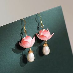 Drawing inspiration from the enchanting artistry of traditional Chinese lotus paintings, this exquisite design showcases a statement waterlily flower adorned with a statement pearl drop. Lotus Paintings, Waterlily Flower, Chinese Lotus, Lotus Painting, Lotus Jewelry, Lotus Earrings, Real Flower Jewelry, Acrylic Flowers, Bracelet Clasps