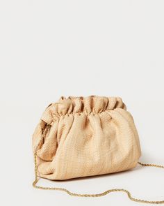 Gathered mini frame clutch in natural raffia. Features a removable twisted gold chain crossbody strap, frame closure, and full lining. Chic Natural Clutch For Spring, Chic Beige Woven Clutch, Chic Natural Woven Clutch, Elegant Natural Evening Bag, Elegant Natural Clutch For Travel, Natural Color Clutch For Party, Gold Pouch Clutch For Summer, Gold Clutch Evening Bag For Spring, Chic Woven Clutch For Formal Occasions