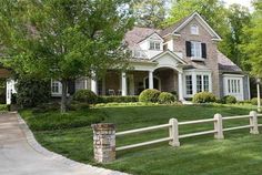 a house with a white picket fence in front of it