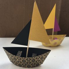 a paper boat sitting on top of a table