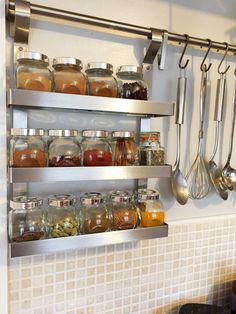 the shelves are filled with spices and cooking utensils