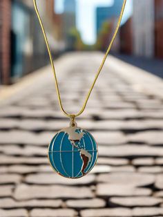 Description Wear this necklace with an adventurous feeling using elements such as this Globe Locket necklace! This metal pendant opens up to reveal a hollow interior and a magnetic closure. The exterior boasts a double-sided map of the world with enameled, turquoise blue oceans. Details chain length: 16-18" (chain might be slightly different than in the pic) Pendant: Globe Locket Length: 1 7/16 " Width: 1 1/4" Metal Color: Gold Features One of a kind, fashion jewelry, everyday jewelry Great gift Jewelry Everyday, Gold Globe, Map Of The World, Necklace Chain Lengths, Special Girl, Metal Pendant, Gold Chain Necklace, Locket Necklace, Everyday Jewelry