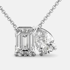 Our Toi et Moi Diamond Necklace. This particular necklace features a stunning emerald-cut Diamond and a pear-shaped Diamond, set side-by-side in a delicate prong setting. The contrast between the two shapes is both eye-catching and elegant. Features: Diamond (G/VS1) 0.55ct or 4.5ct Two-stone design 14K white, yellow, or rose gold Adjustable chain Secure lobster claw clasp Benefits: GIA Diamond Certificate for 4.5 ct Helps focus your energy and amplify your intentions Valuable investment Highest Exquisite White Gold Emerald Necklace With Diamond Cut, Classic Emerald Pendant Necklace With Diamond Cut, Classic Emerald Necklace With Diamond Cut For Formal Occasions, Luxury Diamond Necklace With Emerald Cut And Prong Setting, Luxury Diamond Necklace With Emerald Cut In Prong Setting, Classic Diamond Cut Emerald Necklace For Formal Occasions, Classic Diamond Cut Emerald Pendant Necklace, Classic Emerald Diamond Cut Pendant Necklace, Classic Diamond-cut Emerald Necklace For Formal Occasions