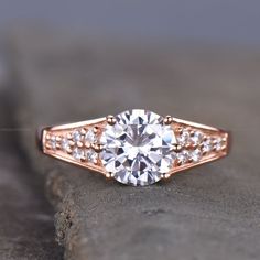 a rose gold engagement ring with round cut diamonds