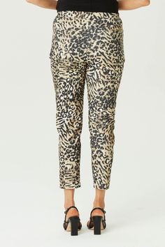 Step out in style with the In the Wild 7/8 Stretch Pant in Black Mix. Featuring a bold animal print, these pants offer a chic and modern look. The 7/8 length and pull-on design with a drawstring waist tie provide comfort and ease. Front stitch rounded jean pockets add a touch of practicality to this fashionable piece. Printed animal design 7/8 length Pull-on style Drawstring waist tie Front stitch rounded jean pockets Our Model Chella is wearing a size XS. She is 175cm tall with an 89cm bust, 74cm waist and 96cm hips. Jean Pockets, Cardigan Vest, Pant Shirt, In The Wild, Stretch Pants, Animal Design, Leisure Wear, Waist Tie, The Wild