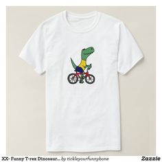 a white t - shirt with an image of a dinosaur riding a bike on it