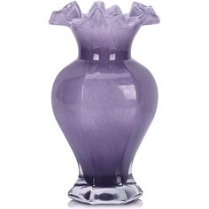 a large purple vase sitting on top of a table