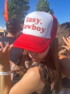 "Easy, Cowboy" red and white trucker hat featuring red writing! Perfect for summer time and country concerts! Any occasion! SnapBack hat so it's adjustable for multiple sizes. Cowboy Hat. Breathable material. Western wear, country concert! Visit my page for similar styles!  Feel free to message me with any questions and I'm sure we can work something out! Trendy Hats For Country Concerts In Summer, Trendy Hats For Summer Country Concerts, Trendy Summer Hats For Country Concerts, Western Style Snapback Hat With Curved Brim For Summer, Casual Snapback Hat For Summer Country Events, Summer Country Style Baseball Cap, Country Style Summer Baseball Cap, Western Style Baseball Cap For Summer Rodeo, Western Style Baseball Cap For Rodeo In Summer