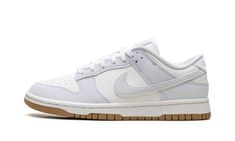 The Nike Dunk Low "Football Grey/Gum" is a colorway of the lifestyle shoe made with an environmentally conscious build.  The shoe features a white leather base and Football Grey leather overlays and Swoosh branding.  A classic “Nike” logo is embroidered on the heel, while a “Nike” logo is paired with a Swoosh on the tongue tag.  Underfoot, the outsole is constructed of recycled Nike Grind material.  Release date: Spring 2024 Nike Dunk Low Next Nature, Gum Shoes, Clothes Wishlist, Nike Shoes Girls, Exclusive Sneakers, Sneakers Looks, Neutral Color Scheme, Nike Shox, Stadium Goods