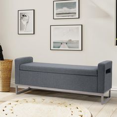 a blue bench sitting on top of a hard wood floor next to a white rug