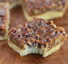 pieces of pecan pie sitting on top of a wooden table