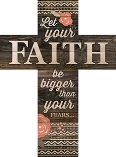 a wooden cross with the words let your faith be bigger than your fear