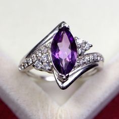 Elegant Purple Crystal Sterling Silver Ring, Purple Crystal Ring With Gemstone Accents For Anniversary, Anniversary Purple Crystal Ring With Gemstone Accents, Purple Square Cut Jewelry For Gifts, Formal Purple Birthstone Crystal Ring, Purple Cubic Zirconia Crystal Ring For Anniversary, Formal Purple Crystal Birthstone Ring, Purple Rings With Rectangular Stone For Anniversary, Purple Rectangular Stone Ring For Anniversary