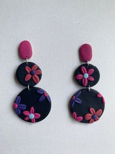 These adorable floral earrings are absolutely perfect! They add a pop of color, but are also finished nicely with stainless steel findings that are completely nickel free! They would also make a fantastic gift! Whimsical Multicolor Flower Charm Earrings, Playful Handmade Multicolor Flower Earrings, Playful Multicolor Handmade Flower Earrings, Dangle Earrings With Flower Charm In Polymer Clay, Trendy Nickel-free Flower-shaped Earrings, Trendy Nickel Free Flower Shaped Earrings, Multicolor Flower Charm Drop Earrings, Whimsical Multicolor Flower-shaped Earrings, Adjustable Multicolor Earrings With Flower Charm