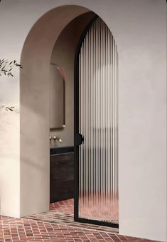 Modern Arch Aluminum Glass Design Door Kamp Studios Plaster, Tub Room, Aluminium Glass Door, Arched Doors, Spanish Revival, غرفة ملابس, Indoor Wall Lights, Pocket Doors, Dream House Decor