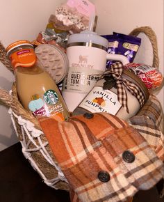 a basket filled with coffee, cookies and other items