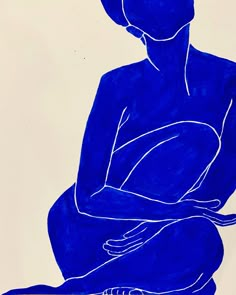 a blue drawing of a woman sitting on the ground