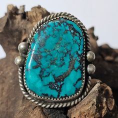 Love the big piece of deep blue turquoise on this larger vintage silver ring.  Double frame of rope work an2 raindrops on each side. Navajo made about 1960s. Nice wide comfortable shank. Tested Sterling. Unmarked like many of the oldies. The ring is size 11 1/2 and weighs 22 grams.    Face is 1 3/4" Inventory #JR 645 Luxury Vintage Blue Turquoise Ring, Handmade Blue Turquoise Ring For Collectors, Vintage Turquoise Ring With Large Stone, Vintage Blue Turquoise Cabochon Ring, Vintage Blue Cabochon Turquoise Ring, Handmade Turquoise Teardrop Ring, Handmade Blue Turquoise Teardrop Ring, Vintage Blue Ring With Large Stone, Handmade Teardrop Turquoise Ring