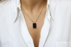 "A Black Onyx necklace is a true embodiment of sophistication and elegance. This gem necklace is handcrafted in 14k gold and features a rectangular Black Onyx gemstone in prongs. Everything about this yellow gold necklace is to love - it is versatile and totally wearable from day until evening. ♥ Gemstone Type - Black Onyx ♥ Gemstone Size - 13x18mm ♥ Gemstone Cut - Rectangle - More options available in the drop down menu ♥ Metal Type (Main Photo) - 14k Gold Filled - More options available in the Everyday Jewelry With Rectangular Gemstone Pendant, Gold Necklaces With Rectangular Stone For Formal Occasions, Gold Jewelry With Rectangular Stone For Formal Occasions, Gold Jewelry With Rectangular Stone For Formal Events, Formal Gold Jewelry With Rectangular Stone, Minimalist Everyday Jewelry With Rectangular Stone, Everyday Minimalist Jewelry With Rectangular Stone, Modern Formal Necklace With Rectangular Pendant, Elegant Formal Necklace With Rectangular Stone Pendant